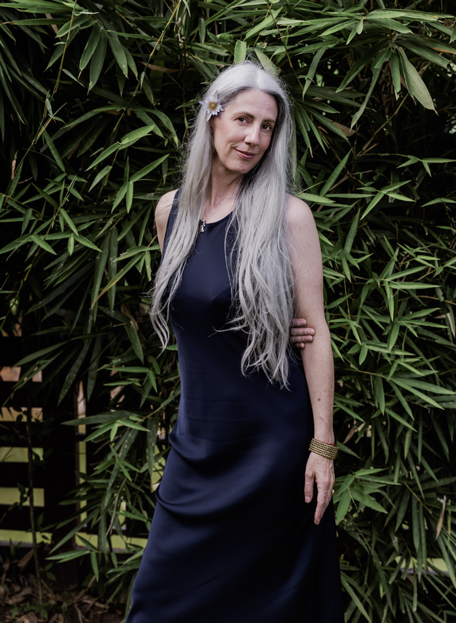Helen Fehr in blue dress with flower in hair